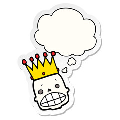 cartoon spooky skull face with crown and thought bubble as a printed sticker