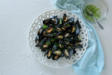 Cooked delicious black mussel, salty white background. Healthy eating concept, rich protein  food