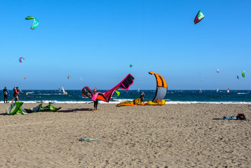 Aerial view of Kitesurfing on the waves of the sea. Kitesurfing, El Medano, Tenerife, Spain.