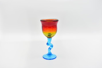 Small glass with colours isolated on a white background.