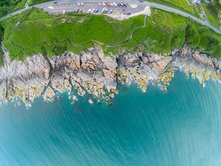 Top view on Coast of sea turquoise water and grassy fields, Irish sea in Newcastle Northern Ireland