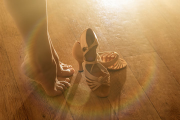 Female legs and shoes for ballroom dancing close-ups. Preparations for the performance, for the dance concept