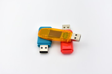 Fototapeta na wymiar USB flash memory drives with colours on a white background.