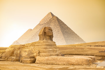 Sphinx and pyramids at sunset