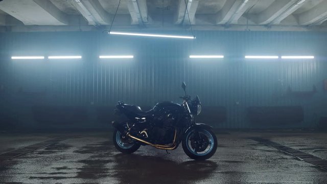 Street sports bike stands in a modern, stylish garage. Included neon lights. Motorcycle advertising. Motorcycle repair services. Need for Speed.