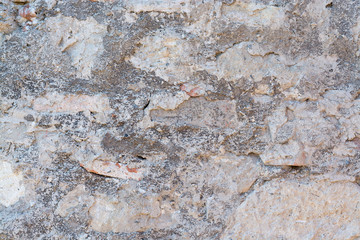 Stone and cement grungy old vintage gray outdoor wall surface