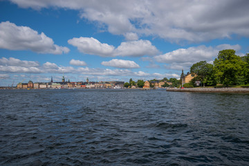 Fototapeta na wymiar Houses and landscape at the inner harbor of Stockholm a summer day.
