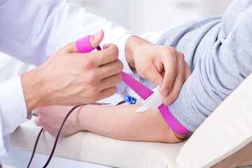 Patient getting blood transfusion in hospital clinic
