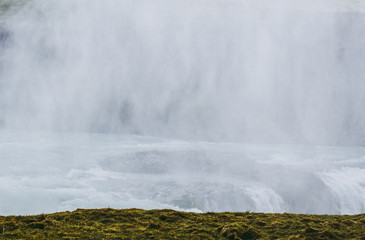 The wall of gray splashes near Gullfoss waterfall