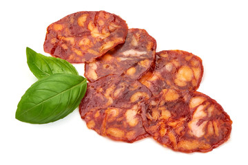 Spanish pork chorizo sausage slices, close-up, isolated on white background