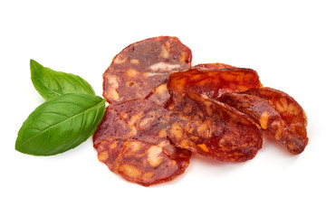 Spanish spicy Chorizo Sausage slices, close-up, isolated on white background