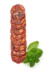 Spanish spicy Chorizo Sausage slices, top view, isolated on white background