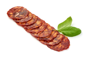 Spanish pork chorizo sausage slices, close-up, isolated on white background