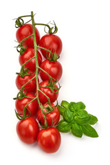 Fresh cherry tomatoes, close-up, isolated on white background