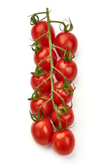 Ripe fresh cherry tomatoes on branch, close-up, isolated on white background