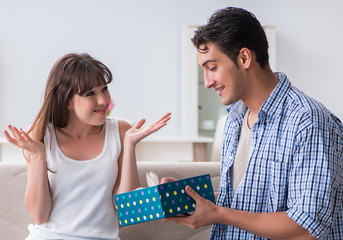 Young woman getting pet rabbit as birthday present