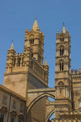 Fototapeta na wymiar Beautiful historical towers of the cathedral of Palermo Sicily, famous tourist Unesco heritage, detail view of towers and arches
