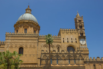 Fototapeta na wymiar Historical cathedral of Palermo Sicily, detail view of the dome and the back side with the bell tower with clock