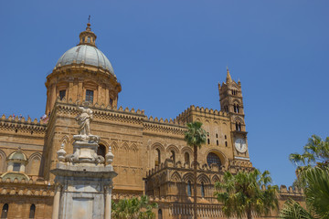 Fototapeta na wymiar Cathedral of Palermo Sicily, front view of this Unesco heritage, view of the dome, bell tower, statues and palms