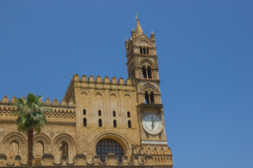 Fototapeta na wymiar Detailed view at the historical cathedral of Palermo Sicily, back side of this medieval architecture with bell tower with clock