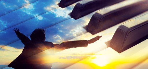 Piano music concept.Piano keys abstract background and man with open arms. Relax music for travel road.