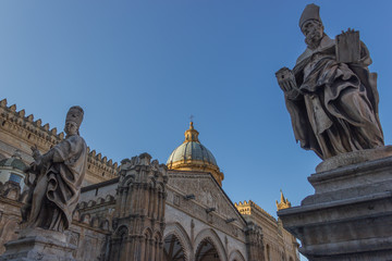 Fototapeta na wymiar Cathedral of Palermo Sicily, beautiful view of the statues at the yard in front of the historical church, dome and old portal in background