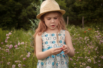little girl in a flower field