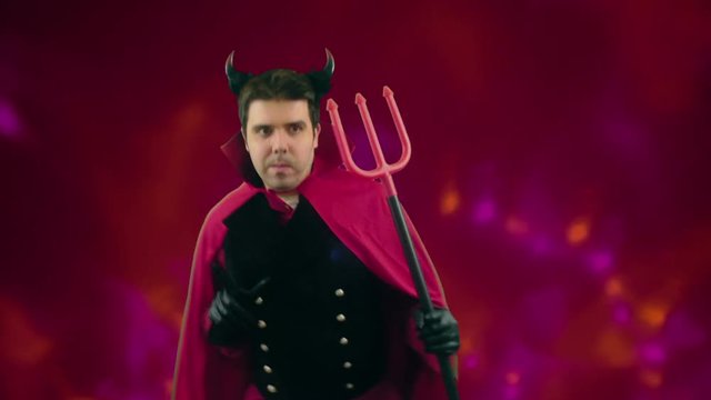 devil man dancing in halloween party