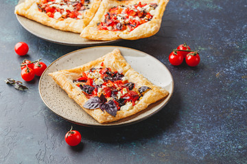 Tomato tarts with addition of aromatic herbs