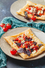 Tomato tarts with addition of aromatic herbs