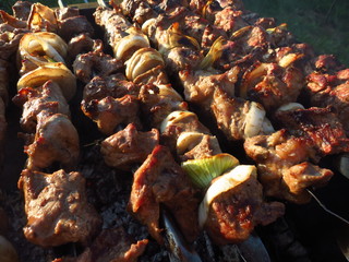 Preparing the skewers on the grill