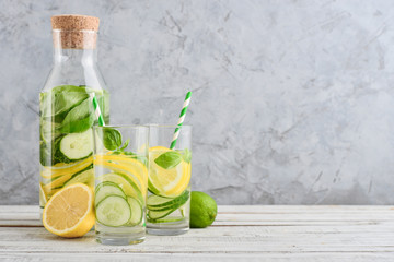 Bottle and two glasses with infused water