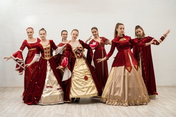 Group of women in gorgeous ball dresses view