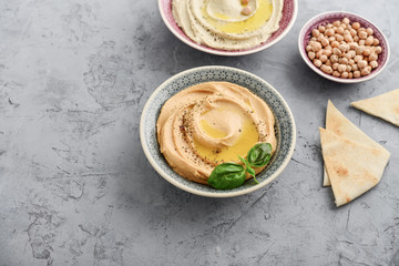 Bowls with different kinds hummus