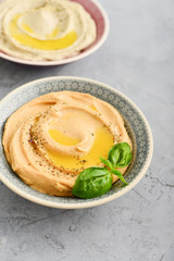 Bowls with different kinds hummus
