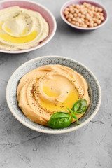 Bowls with different kinds hummus