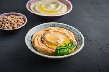 Bowls with different kinds hummus