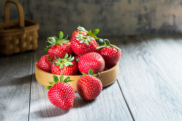 strawberries in wooden cup