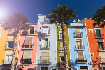 Naklejka premium Closeup facades of colorful houses in the street of the old village of Villajoyosa, Costa Blanca, Spain