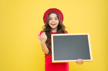 information board. Fashion news. small girl kid with school backboard, copy space. back to school. Interesting info. big sales. child on yellow background. happy girl in french beret. small publisher