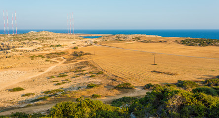  beautiful panoramic view of Cape Cavo Greco, filled with the gentle sunset sun