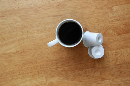 Cup Of Coffee With Coffee Pods 