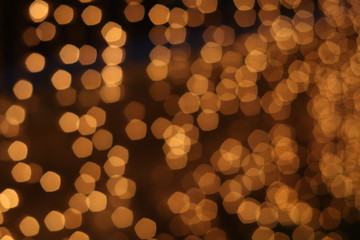 Golden abstract background with bokeh defocused lights