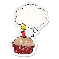 cartoon birthday cupcake and thought bubble as a distressed worn sticker