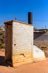 Fototapeta premium Dry toilet which uses no water and has to be emptied manually, at a township on the outskirts of Otjiwarongo, Namibia