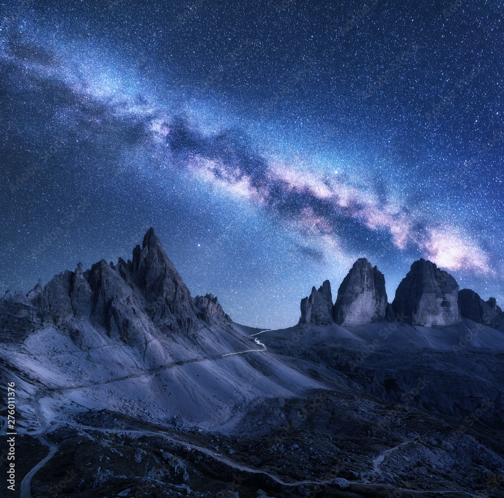 Wall mural milky way over mountains at starry night in summer. amazing landscape with alpine mountains, blue sk