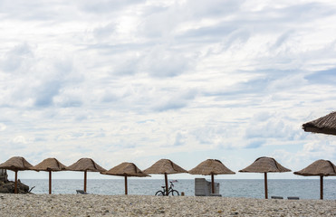 people relax on a pebbly sea beach
