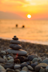 stack of zen stones on pebble beach