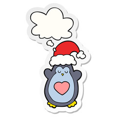 cute christmas penguin and thought bubble as a printed sticker