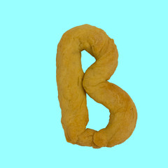 The letter "B" made from pastry, which can be eaten.
